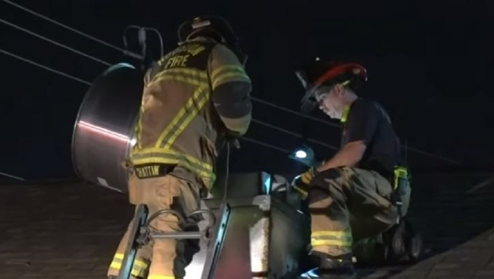 Houston firefighters rescue a woman who was trapped in an air vent in a vacant home early Friday.
