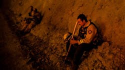 A firefighter takes a break during a burn operation near the town of Ladoga, CA, during the Mendocino Complex fire. A firefighter takes a break during a burn operation near the town of Ladoga, CA, during the Mendocino Complex fire.