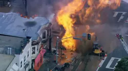 San Francisco firefighters battled flames that shot 40 feet in the air following a gas line explosion.