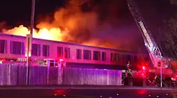 Firefighters rescued two people trapped by smoke and flames on the second floor of a San Antonio apartment complex late Sunday.