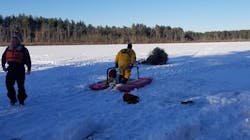 Sudbury, MA, firefighters used a sled to help rescue a cross-country skier who fell through a frozen lake Tuesday.