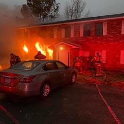 Neighbors with a ladder were able to rescue three people from a burning Morehead City apartment Wednesday.