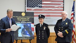 Elmer Wienclawski (center), a 99-year-old veteran and active member of the Brighton Volunteer Fire Department since 1959, was honored by New York state Sen. Chris Jacobs (left) last month.