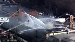 More than 100 firefighters responded to a massive seven-alarm fire that broke out at a Boston casket company Friday afternoon. More than 100 firefighters responded to a massive seven-alarm fire that broke out at a Boston casket company Friday afternoon.