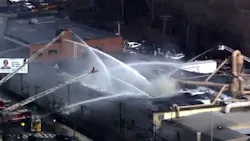 More than 100 firefighters responded to a massive seven-alarm fire that broke out at a Boston casket company Friday afternoon. More than 100 firefighters responded to a massive seven-alarm fire that broke out at a Boston casket company Friday afternoon.