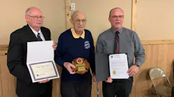 John Pokos, 92 (center), was honored Monday by Pennsylvania State Fire Commissioner Bruce Trego (left) and Somerset County Commissioner Gerald Walker.