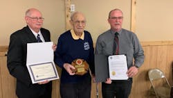 John Pokos, 92 (center), was honored Monday by Pennsylvania State Fire Commissioner Bruce Trego (left) and Somerset County Commissioner Gerald Walker.