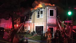New Orleans firefighters rescued four people from a three-alarm fire that was caused when a vehicle crashed into the building Wednesday night. New Orleans firefighters rescued four people from a three-alarm fire that was caused when a vehicle crashed into the building Wednesday night.