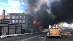 Firefighters from multiple departments responded to a five-alarm blaze involving several buildings in Quincy on Tuesday morning. Firefighters from multiple departments responded to a five-alarm blaze involving several buildings in Quincy on Tuesday morning.