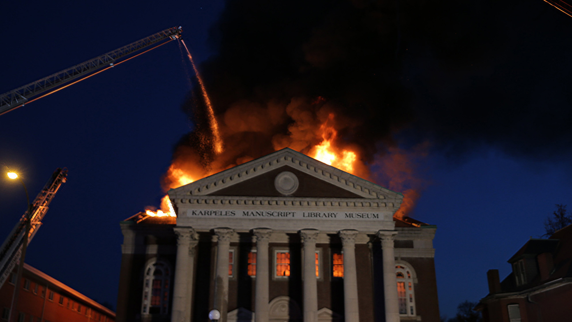 Firefighters battled a four-alarm blaze at St. Louis&rsquo; Karpeles Manuscript Library Museum on Tuesday.