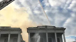 New Orleans firefighters battled a five-alarm blaze Monday that apparently began in a small house before spreading to a neighboring apartment building.