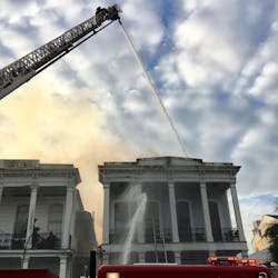 New Orleans firefighters battled a five-alarm blaze Monday that apparently began in a small house before spreading to a neighboring apartment building. New Orleans firefighters battled a five-alarm blaze Monday that apparently began in a small house before spreading to a neighboring apartment building.