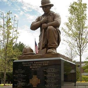 A monument stands in Brockton, MA, to remember the 13 firefighters who died in the Strand Theatre fire on March 10, 1941.