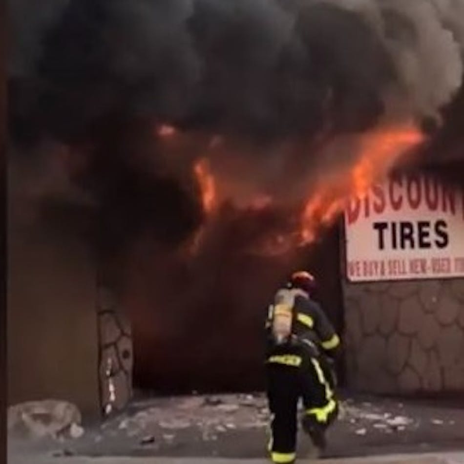 Dozens of firefighters tackled a &apos;tenacious tire store blaze&apos; in Hallandale Beach on Friday night.