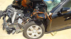 The crushed fender of this 2010 KIA Optima hides everything you need to see for successfully rolling or jacking the dash to free trapped occupants. Moving or removing the fender will provide crews with a clearer picture of the task at hand. Photos by Ron Moore