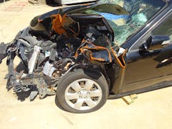 The crushed fender of this 2010 KIA Optima hides everything you need to see for successfully rolling or jacking the dash to free trapped occupants. Moving or removing the fender will provide crews with a clearer picture of the task at hand. Photos by Ron Moore The crushed fender of this 2010 KIA Optima hides everything you need to see for successfully rolling or jacking the dash to free trapped occupants. Moving or removing the fender will provide crews with a clearer picture of the task at hand. Photos by Ron Moore