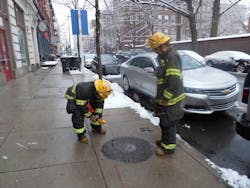 Philadelphia crews check use atmospheric monitoring devices to check a manhole downtown.