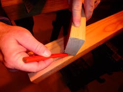 Figure 5: The location of the return cut is where 1½ inches reaches from the raker angle drawn to the edge of the lumber. This can be done with a speed square, tape measure or a scrap piece of wood. Figure 5: The location of the return cut is where 1½ inches reaches from the raker angle drawn to the edge of the lumber. This can be done with a speed square, tape measure or a scrap piece of wood.