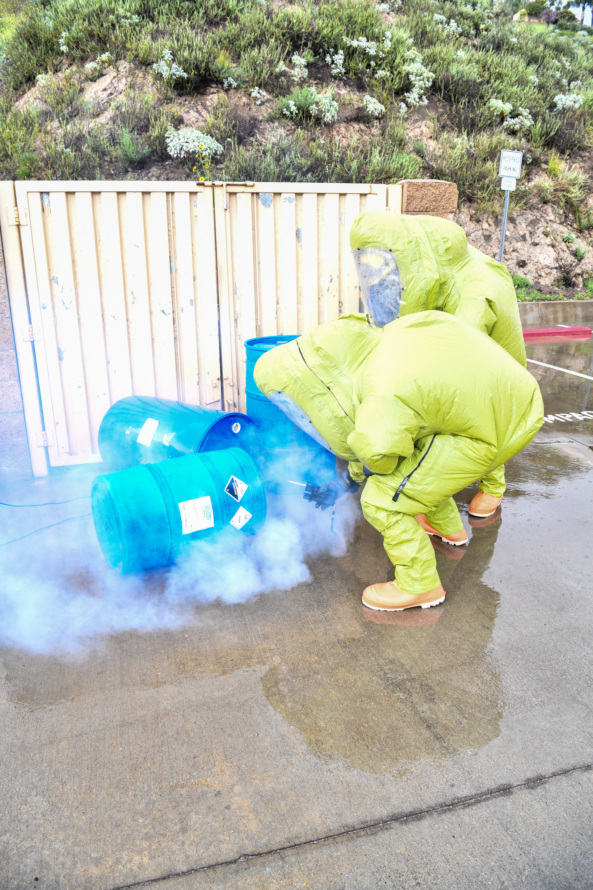 Firefighters use detection devices during a hazmat training exercise.