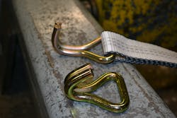 In separate tests, a new twin hook end from a tie-down ratchet strap unit was pulled to failure; bending and failing at 7,380 pounds. This component has a WLL of 2,600 with a 3:1 safety ratio. In separate tests, a new twin hook end from a tie-down ratchet strap unit was pulled to failure; bending and failing at 7,380 pounds. This component has a WLL of 2,600 with a 3:1 safety ratio.