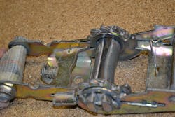 Destructive testing on the in-service ratchet tie-down unit caused not only webbing failure, but also resulted in damage to the core (called the mandrel) of the ratchet unit itself.