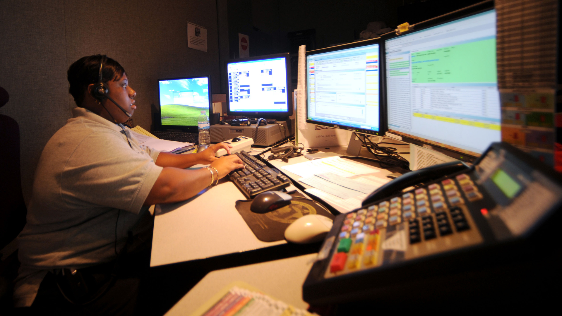 Boynton Beach, FL, 9-1-1 dispatcher trainee Shenitta Garvin answers a call during an afternoon shift in 2010.