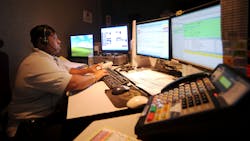 Boynton Beach, FL, 9-1-1 dispatcher trainee Shenitta Garvin answers a call during an afternoon shift in 2010.