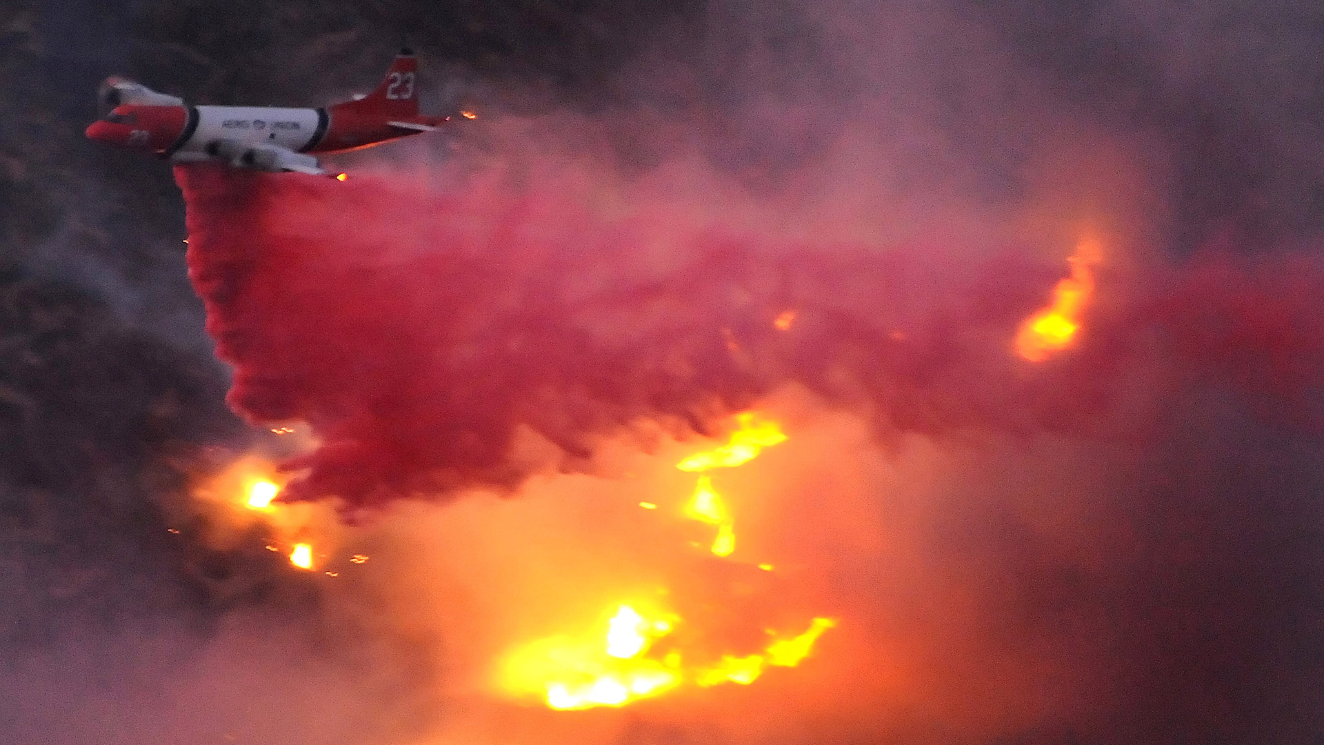 An air tanker drops water on a wildfire in California's San Fernando Valley in 2008.