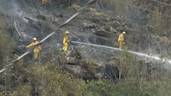Nearly 50 Honolulu firefighters battled a brush fire Sunday in Kalihi. Nearly 50 Honolulu firefighters battled a brush fire Sunday in Kalihi.