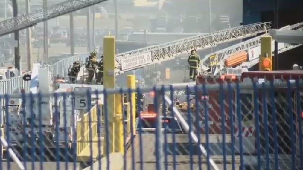 About 70 firefighters responded to a blaze Monday at a Providence, RI, recycling facility after 20 cars caught fire while being crushed.