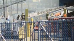 About 70 firefighters responded to a blaze Monday at a Providence, RI, recycling facility after 20 cars caught fire while being crushed.
