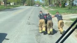 Raytown, MO, firefighters helped a fisherman get home by pushing his electric wheelchair after the chair became stuck and its battery was drained of power. Raytown, MO, firefighters helped a fisherman get home by pushing his electric wheelchair after the chair became stuck and its battery was drained of power.