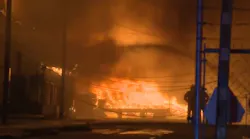 Stockton, CA, firefighters battled a six-alarm fire Tuesday that caused millions in damage and had thousands without power.