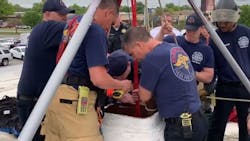 Tulsa, OK, firefighters pulled a burglary suspect from a business chimney, where he was trapped for nearly 10 hours Monday. Tulsa, OK, firefighters pulled a burglary suspect from a business chimney, where he was trapped for nearly 10 hours Monday.