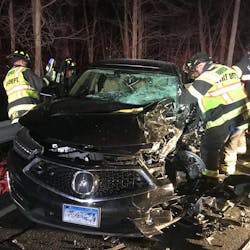 Fairfield, CT, firefighters rescued three people from an overturned pickup truck and an SUV following a head-on collision with the two vehicles Wednesday night. Fairfield, CT, firefighters rescued three people from an overturned pickup truck and an SUV following a head-on collision with the two vehicles Wednesday night.