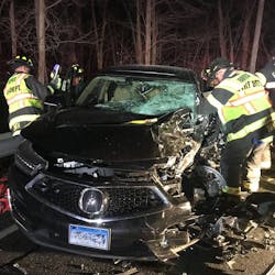 Fairfield, CT, firefighters rescued three people from an overturned pickup truck and an SUV following a head-on collision with the two vehicles Wednesday night.