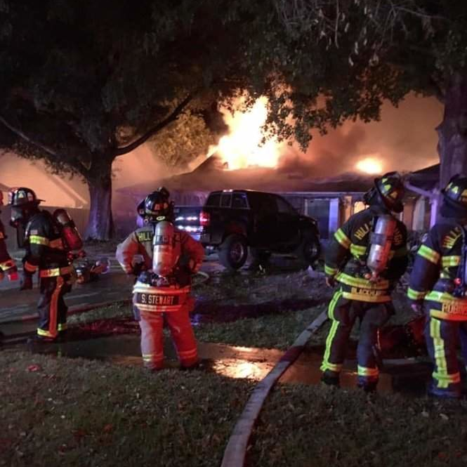 Hillsborough Fire Rescue firefighters battle a massive house fire in Tampa's Northdale neighborhood late last year.