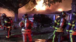 Hillsborough Fire Rescue firefighters battle a massive house fire in Tampa's Northdale neighborhood late last year.