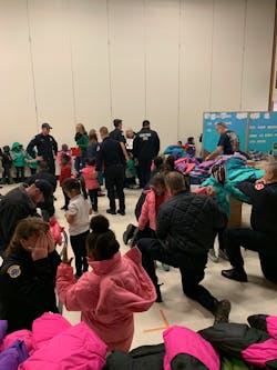 With the support of IAFF Local 82, the firefighters of Minneapolis partnered with the national non-profit Operation Warm to provide new winter coats to children in need. With the support of IAFF Local 82, the firefighters of Minneapolis partnered with the national non-profit Operation Warm to provide new winter coats to children in need.