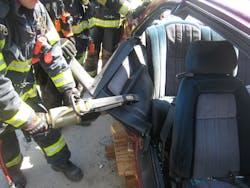 Crews clamp the spreaders on a 45-degree angle to the third door section and bend downward to access the rear seat. Crews clamp the spreaders on a 45-degree angle to the third door section and bend downward to access the rear seat.