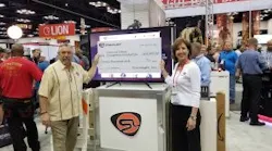 Dawn Dalldorf-Jackson, Streamlight Director of Sales, Industrial/Fire Divisions (right) presents Streamlight’s donation check to NFFF Chief Ronald Siarnicki.