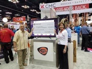 Dawn Dalldorf-Jackson, Streamlight Director of Sales, Industrial/Fire Divisions (right) presents Streamlight&rsquo;s donation check to NFFF Chief Ronald Siarnicki.
