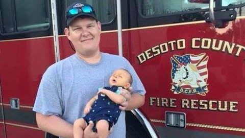 DeSoto County, FL, firefighter Brad Gregrich with his son.