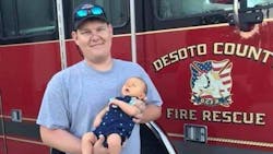 DeSoto County, FL, firefighter Brad Gregrich with his son.