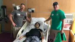 Firefighters from Cobb and Cherokee conunties have been providing suppport to 17-year-old Logan Droke (center), who is graduatig from high school this week as he faces his fourth battle with cancer.