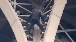 A man climbed up half the height of the Eiffel Tower before Paris firefighters were able to talk him to safety Monday.
