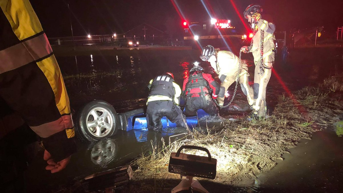 Houston firefighters rescued the occupant of a submerged vehicle that had flipped upside down into a flooded ditch.