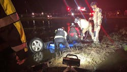 Houston firefighters rescued the occupant of a submerged vehicle that had flipped upside down into a flooded ditch. Houston firefighters rescued the occupant of a submerged vehicle that had flipped upside down into a flooded ditch.