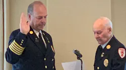 Needham, MA, Fire Chief Dennis Condon (left) is sworn in Tuesday as the new president of the Fire Chiefs Association of Massachusetts.