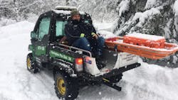 UTV-based apparatus is well suited for traversing snowy trails to pick up patients in remote areas.